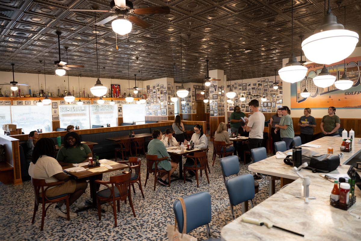 The main dining area at The Downtowner in Gulfport is decorated with old photos and memorabilia.