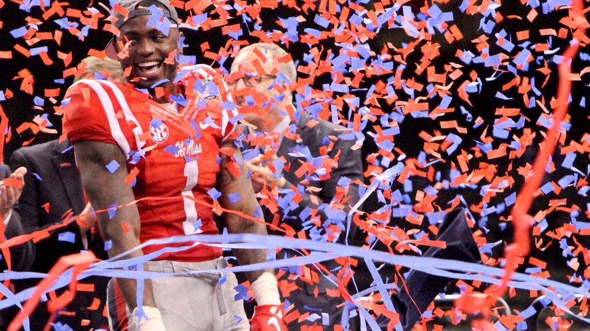 TIM ISBELL/SUN HERALD 
 Laquon Treadwell enjoys a shower of red and blue confetti after Ole Miss defeated OSU at All State Sugar Bowl in New Orleans, Friday, Jan. 1, 2016.
