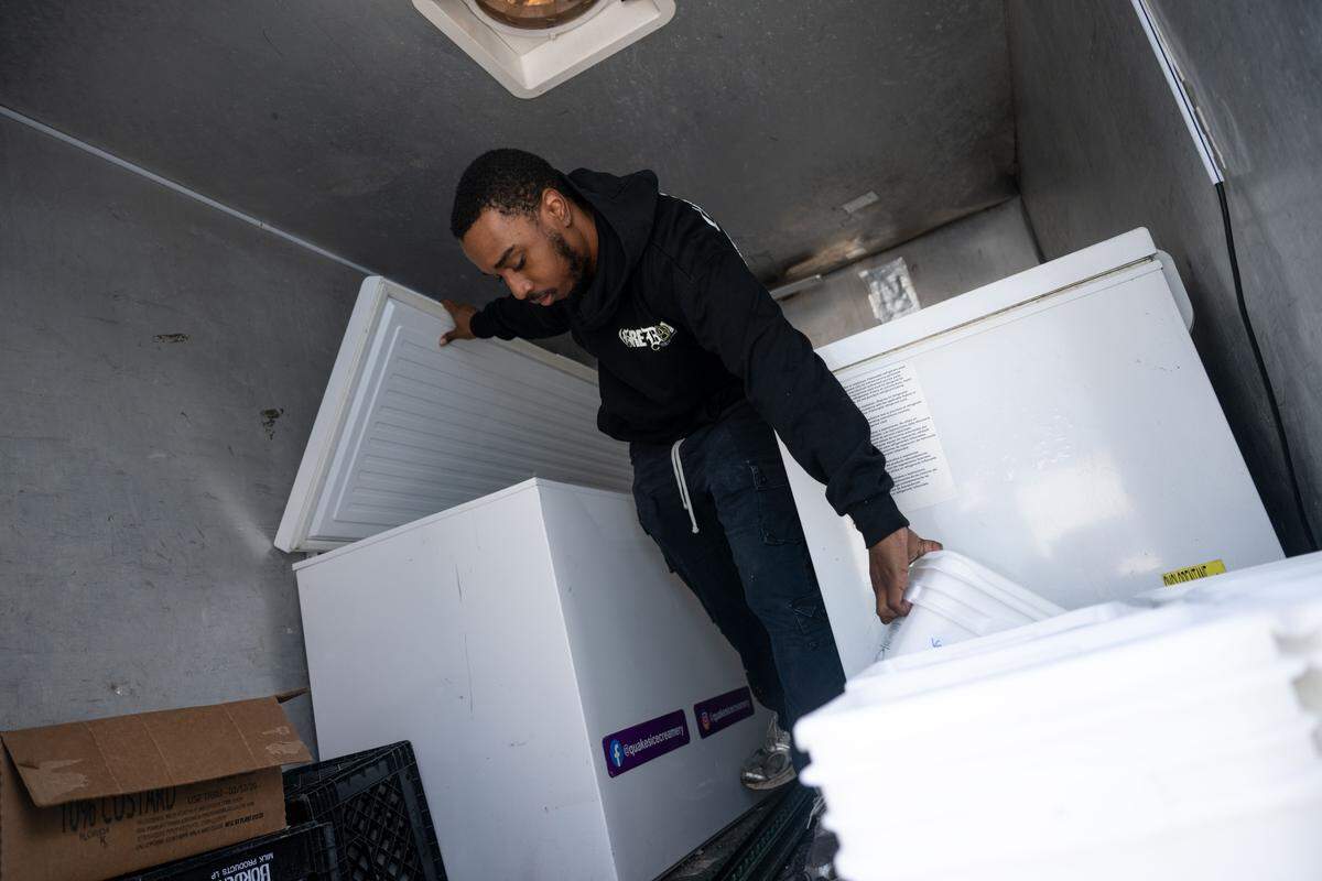 Kaleb Heidelberg loads ice cream onto a truck headed to the Quakes Ice Creamery in Ocean Springs at the Quakes distribution center in Vancleave.