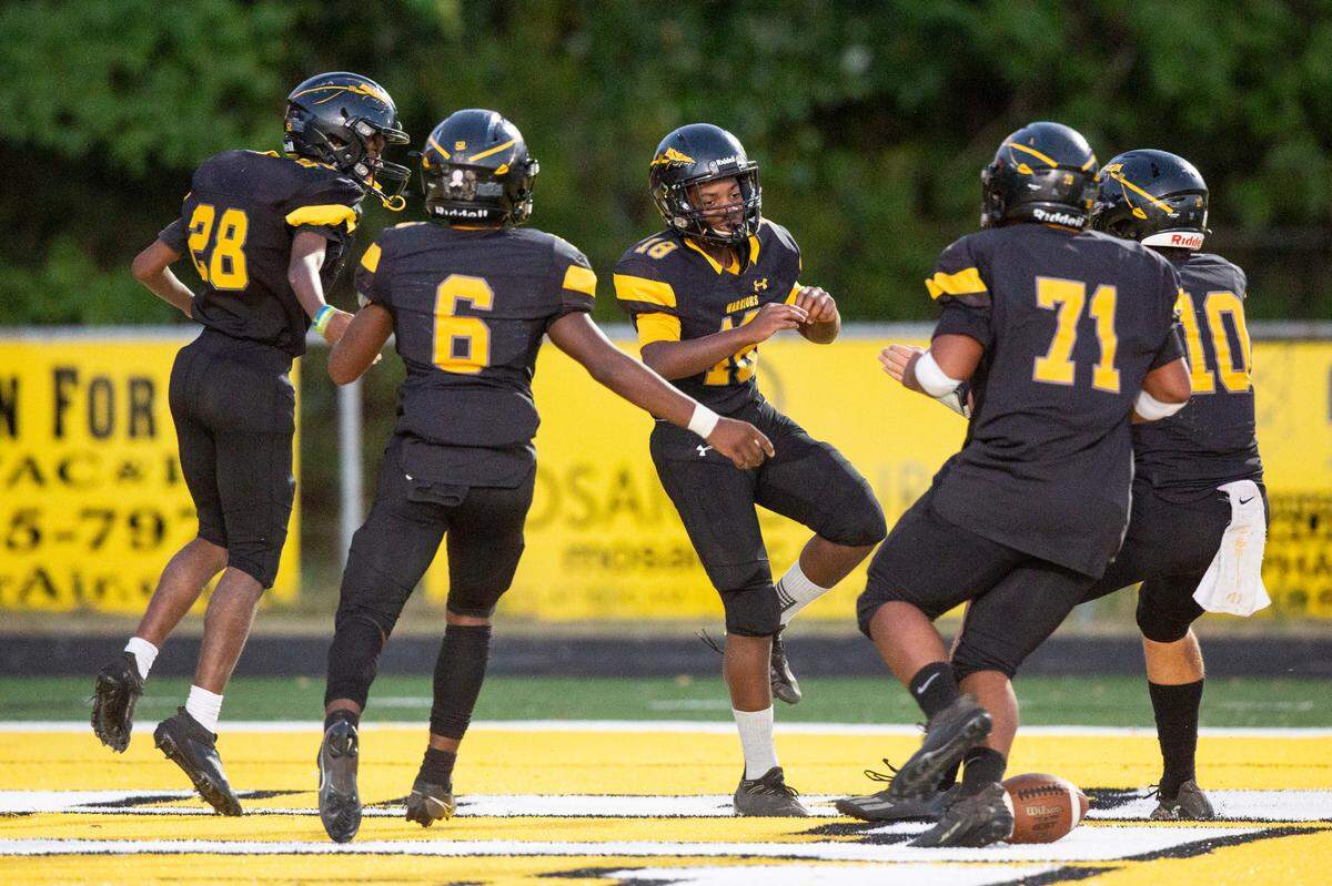 Tyler Hunter, the student manager for D’Iberville’s JV football team, celebrates with his teammates after scoring during a game against St. Martin at Warrior Stadium in D’Iberville on Monday, Oct. 9, 2023. Hunter, who has an intellectual disability, suited up for the team’s final game and scored two touchdowns.