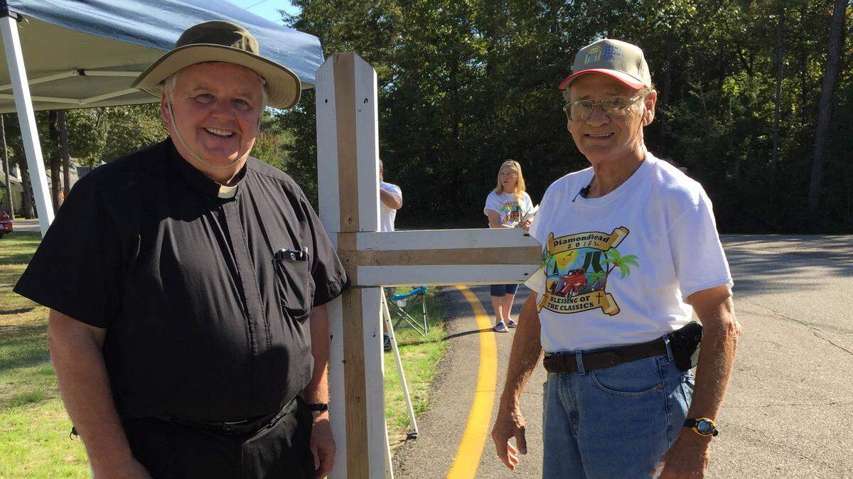 JEFF CLARK/SPECIAL TO THE SUN HERALD 
 Rev. Paddy Mockler and Blessing of the Classics coordinator Mark Duffy pause for a moment as classic vehicles roll up Diamondhead Drive East.
