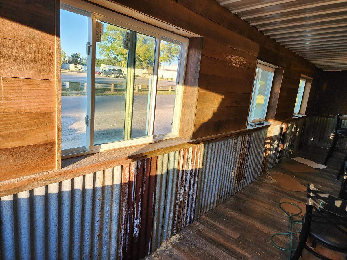 Tin wainscoting is adding country charm to PotBellies Burgers and Barbecue, opening soon in Vancleave.