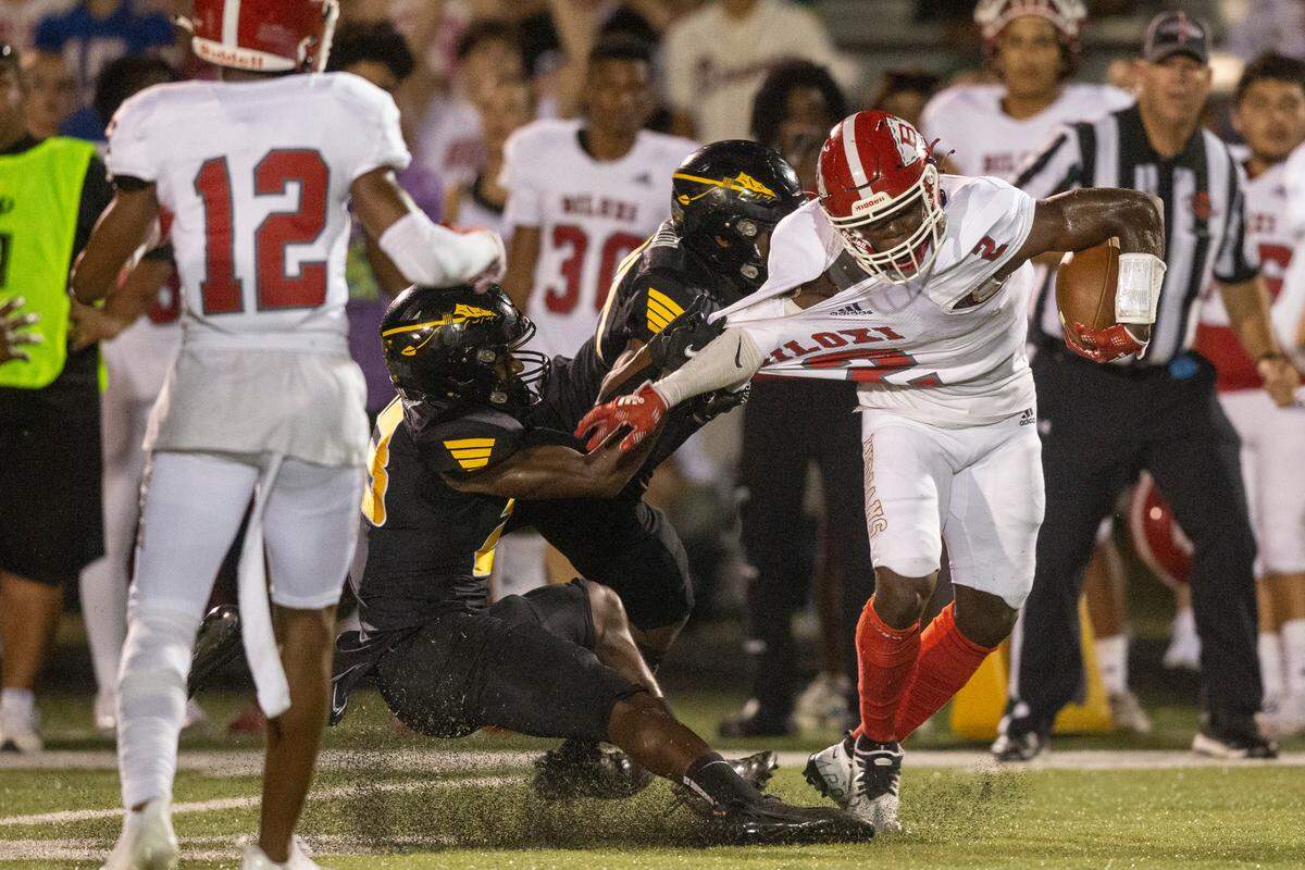 Biloxi’s Damaryion Fillmore breaks away from a tackle during a game against D’Iberville at Warriors Stadium in D’Iberville on Friday, Sept. 23, 2022.