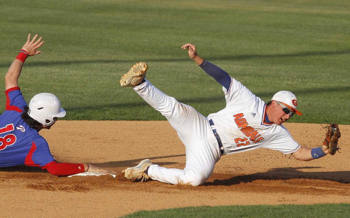Gulfport shortstop Gabe Lacy falls after tagging out Pascagoula’s Frederic Reynolds during the second inning of their 6A playoff game at Herb Wilson Field in Gulfport on April 26, 2018. Former Sun Herald photographer John Fitzhugh won first place for best sports photo at the Mississippi Press Association’s 2019 Better Newspaper Contest.
