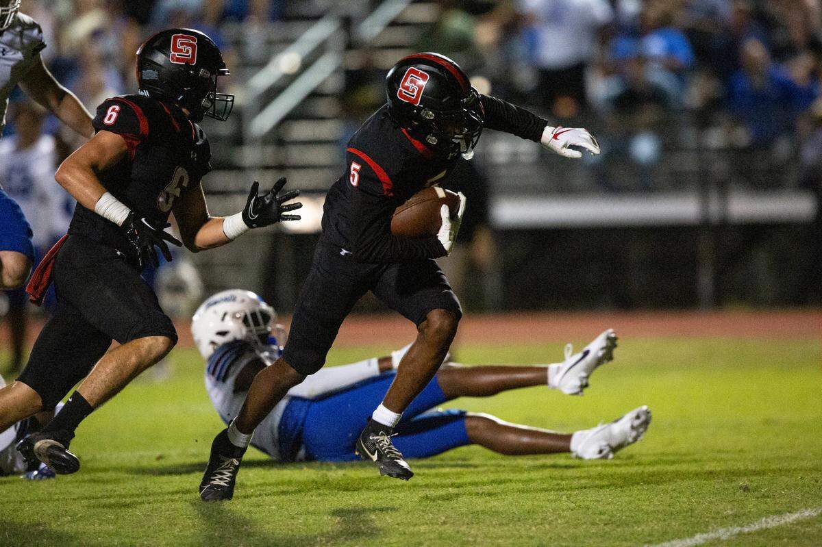 St. Stanislaus’ Ethan Galloway breaks away from Stone’s defense during a game against the Stone Tomcats at St. Stanislaus High School in Bay St. Louis on Friday, Sept. 29, 2023.