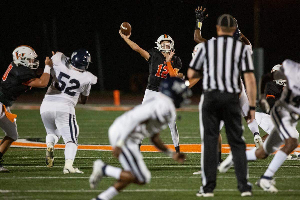 West Harrison Hurricanes’ quarterback Brady Martin throws a touchdown pass during a game against Moss Point at West Harrison High School in Gulfport on Friday, Sept. 22, 2023.