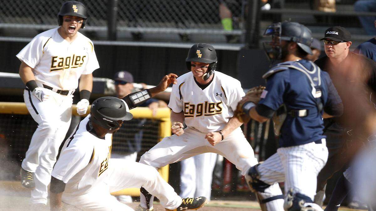 TIM ISBELL/SUN HERALD 
 Southern Miss teammates react as catcher Chuckie Robinson scores against Rice, Saturday, Apr. 23, 2016.