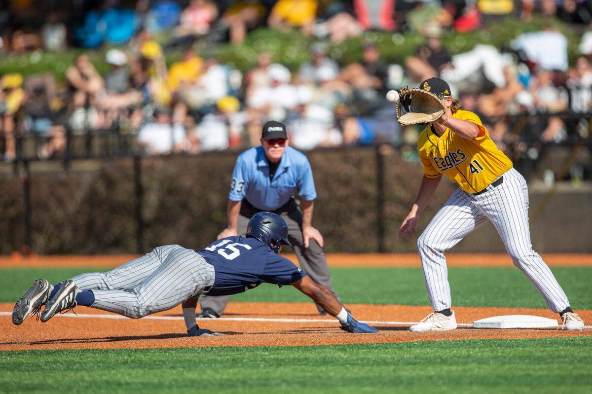 Southern Miss’s Christopher Sargent catches a ball at first base as UTSA’s Ian Bailey slides back to first base during a game against UTSA during the Conference USA tournament at Pete Taylor Park in Hattiesburg on Saturday, May 28, 2022.