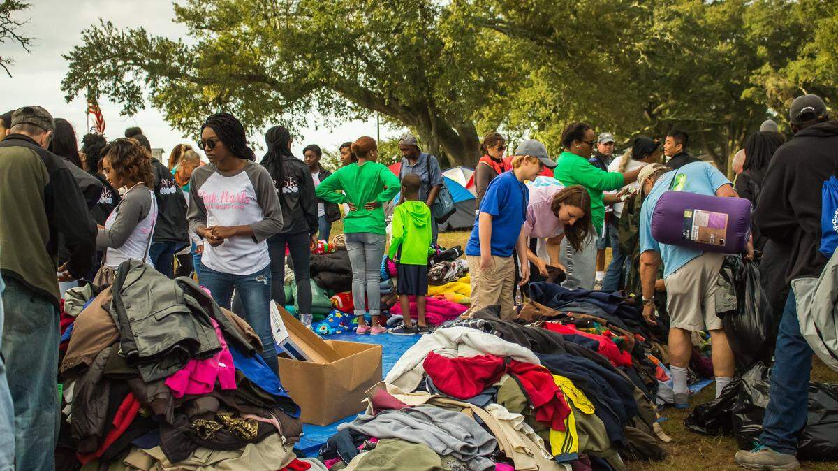 COURTESY BRITTANY A. SCOTT 
 More than 100 Coast homeless men and women received coats, blankets, tents, sleeping bags and other camping gear during Camping for Hope, hosted by Gulf Coast Community Ministries. The giveaway was Saturday on U.S. 90 in downtown Gulfport. In its third year, Camping for Hope is supported by collection drives and financial support from First Baptist Church of Gulfport, Northwood Church, Gulf Coast Business Supply and many others. The goal of the giveaway is to help prepare homeless men and women for the winter's cold. Free breakfast, first aid, haircuts and Bibles were also provided.