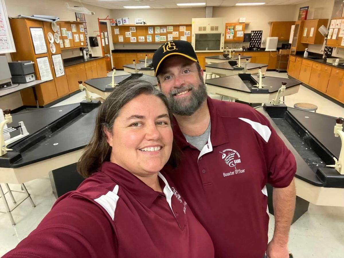 Robert Smith smiled for a photo with his wife, Sherri, in his classroom at Gautier High School before a football game one evening against East Central High School.
