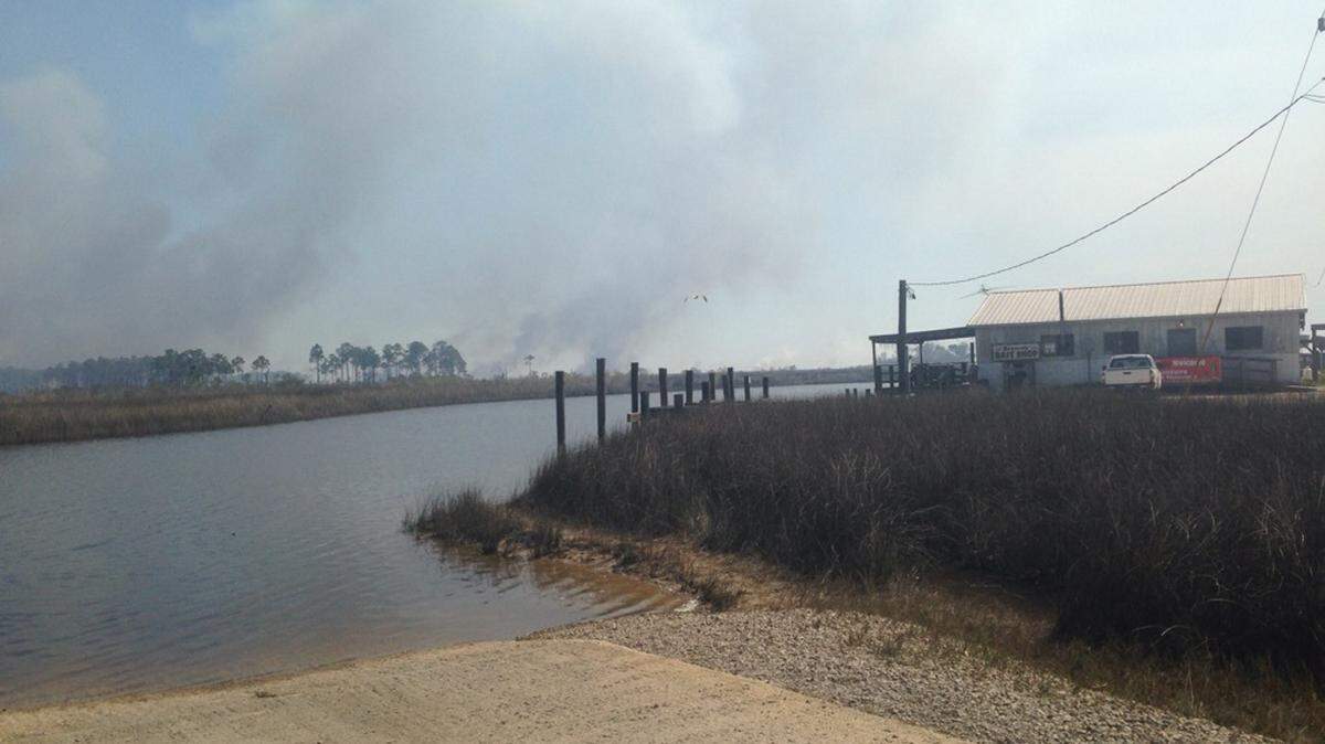 COURTESY U.S. WILDLIFE AND FISHERIES 
 A fire that started in Jackson County on Thursday has spread over 900 acres and into Alabama. Officials say the fire is burning in most unhabited areas.