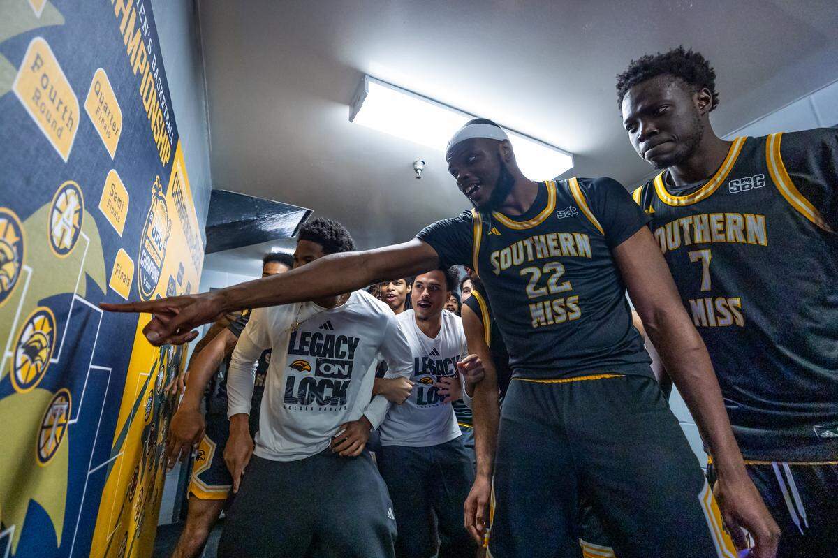 Southern Miss players celebrate Saturday after knocking off Appalachian State in the quarterfinals of the Sun Belt Tournament in Pensacola.