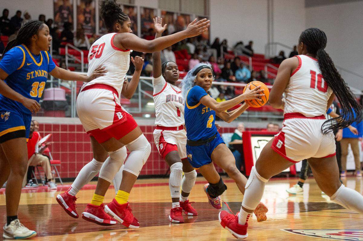 St. Martin’s D’Kylah Jenkins protects the ball from Biloxi’s defense during a game between Biloxi and St. Martin at Biloxi High School in Biloxi on Tuesday, Jan. 7, 2025.