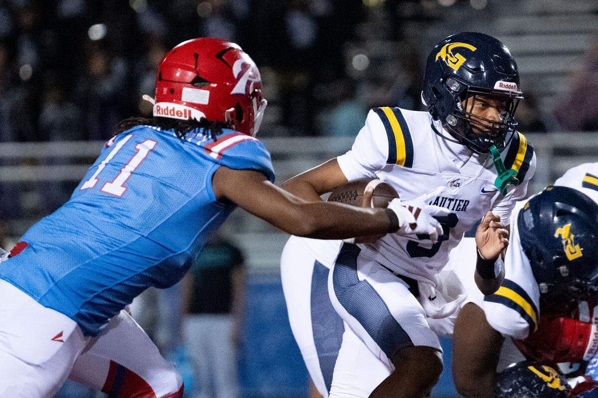 Gautier quarterback Keon McNeil (9) scrambles with the ball during a football game at Pascagoula High School on Thursday, Nov. 6, 2025.