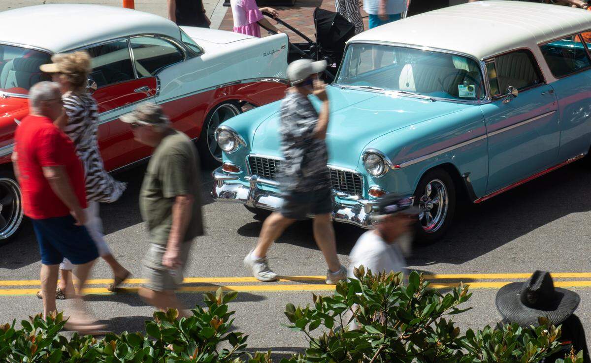 Spectators walk among classic cars in downtown Biloxi during the Biloxi Block Party, one of many Cruisin’ the Coast events, on Wednesday, Oct. 4, 2023. It’s again the favorite car show in the country, as voted on by USA Today readers.