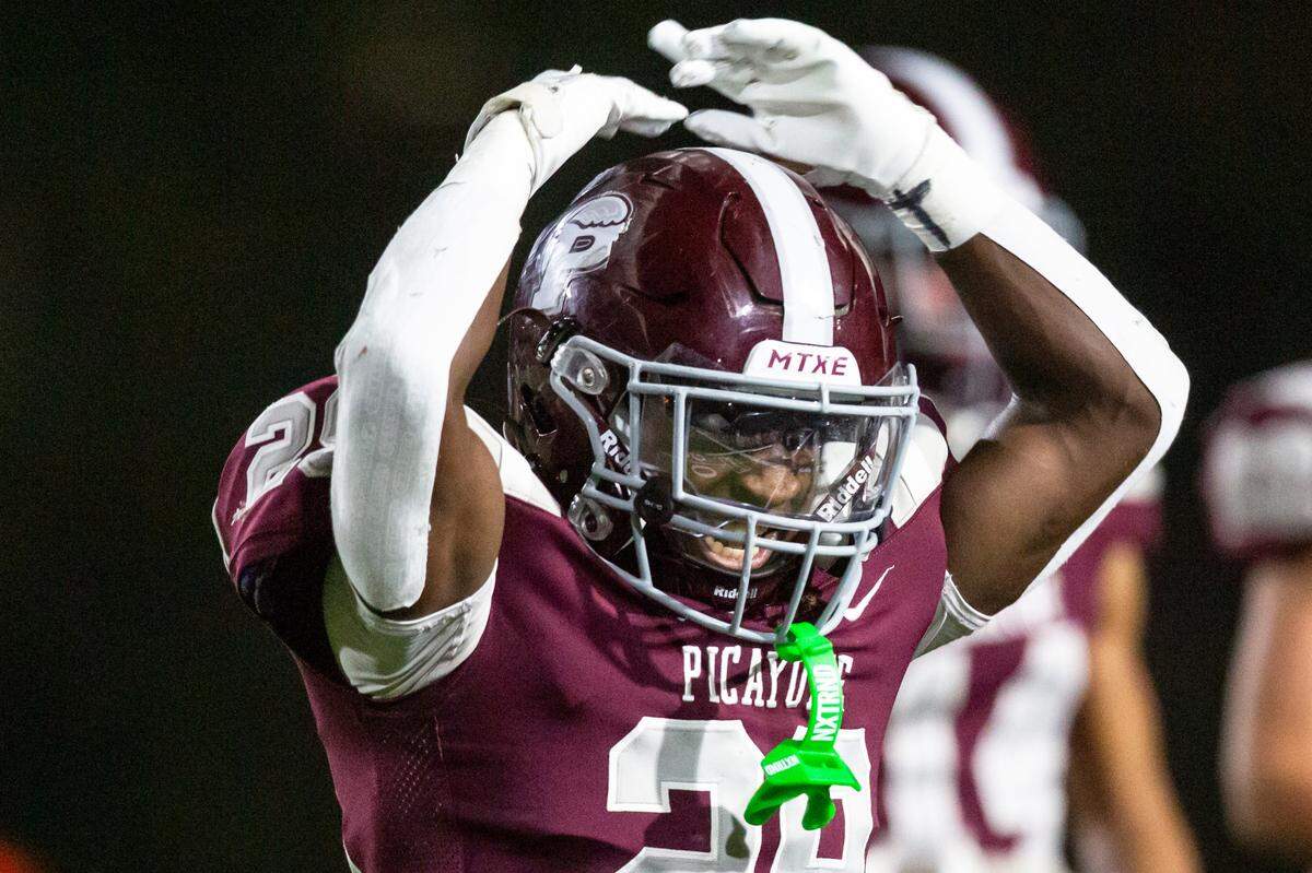 Picayune’s Amarion Tyson hypes up the crowd during a playoff game at Lee-Triplett Stadium in Picayune on Friday, Nov. 17, 2023.