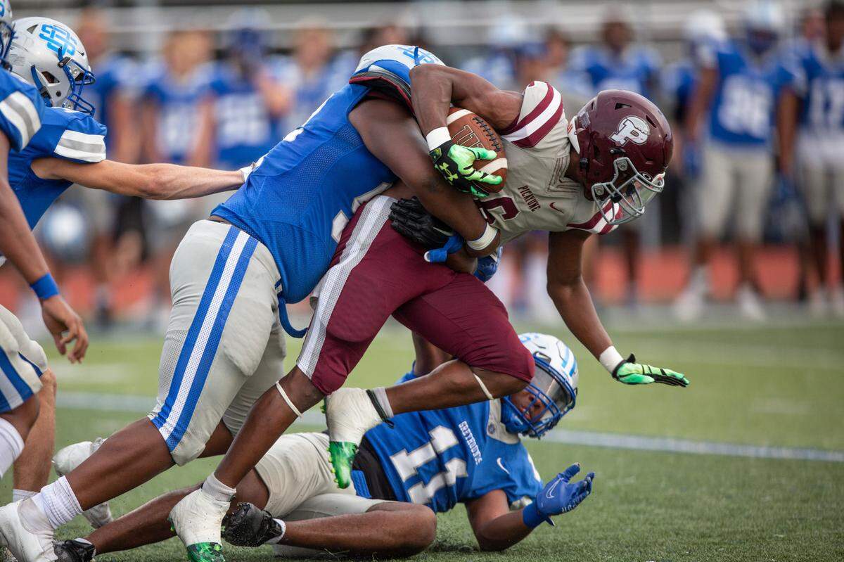 The Ocean Springs defense tackles a Picayune player during a Spring Game against Picayune at Greyhound Stadium in Ocean Springs on Friday, May 13, 2022.