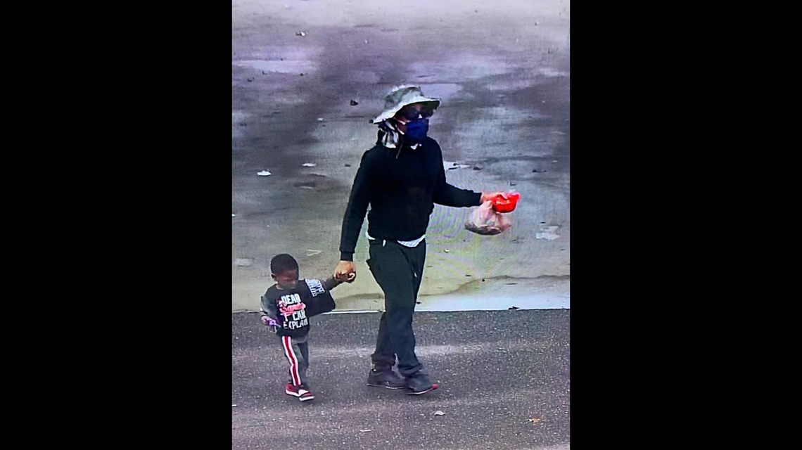 A man was seen leading the child to the Goodwill drop off location.