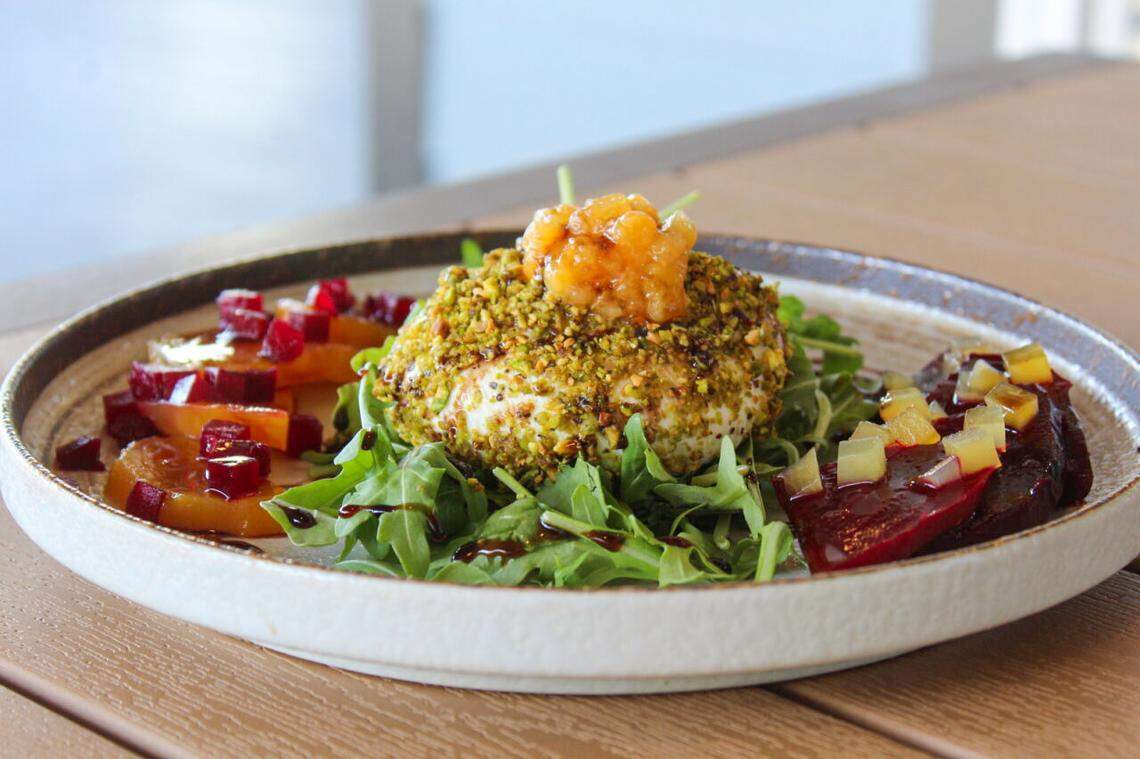 The beet and burrata salad at Catch 110 in Biloxi, featuring pistachio coated burrata, arugula, red and gold beets, pickled beets, apricots topped with honey balsamic.