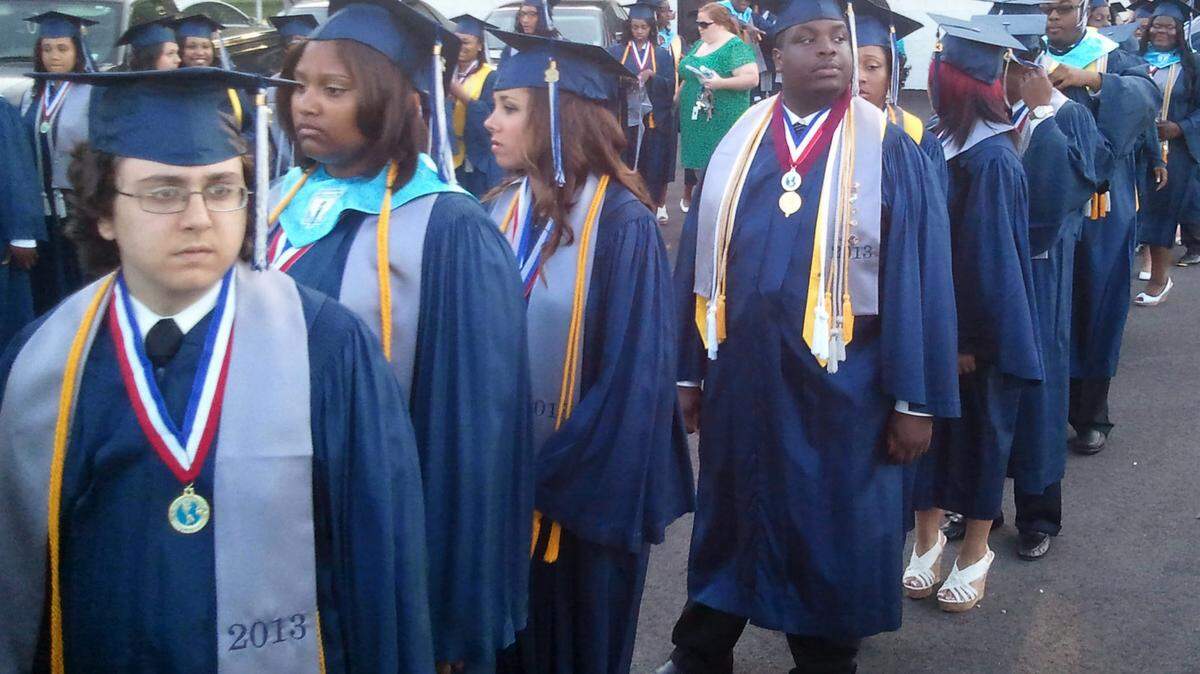 KAREN NELSON/SUN HERALD 
 Moss Point High School students line up for their graduation ceremony in May 2013. Moss Point High School has highest absentee rate and the lowest graduation rate in South Mississippi.