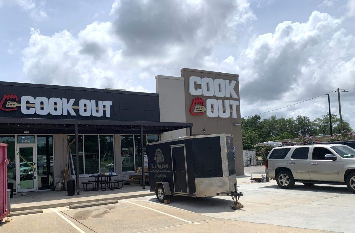 A big sign appeared on the Cookout restaurant that is opening soon in Gulfport. Crews are installing more signs and adding the finishing touches to the burger, barbecue and shakes place.
