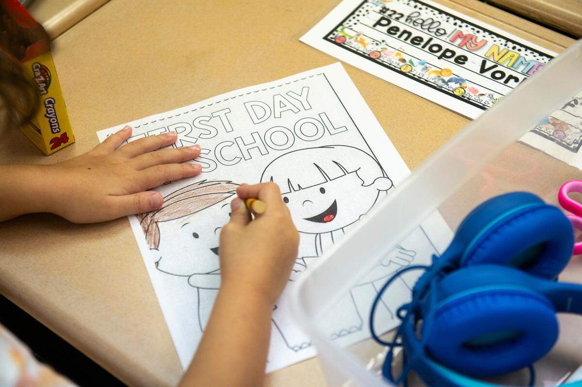Students at Magnolia Park Elementary in Ocean Springs fill out a first day of school coloring sheet on Friday, Aug. 5, 2022.