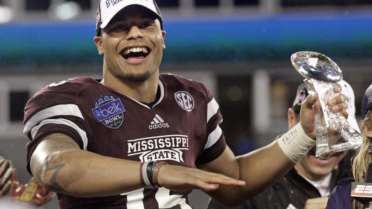 Mississippi State quarterback Dak Prescott (15) celebrates after Mississippi State won the Belk Bowl NCAA college football game against North Carolina State in Charlotte, N.C., Wednesday, Dec. 30, 2015. Mississippi State won 51-28. (AP Photo/Nell Redmond)
