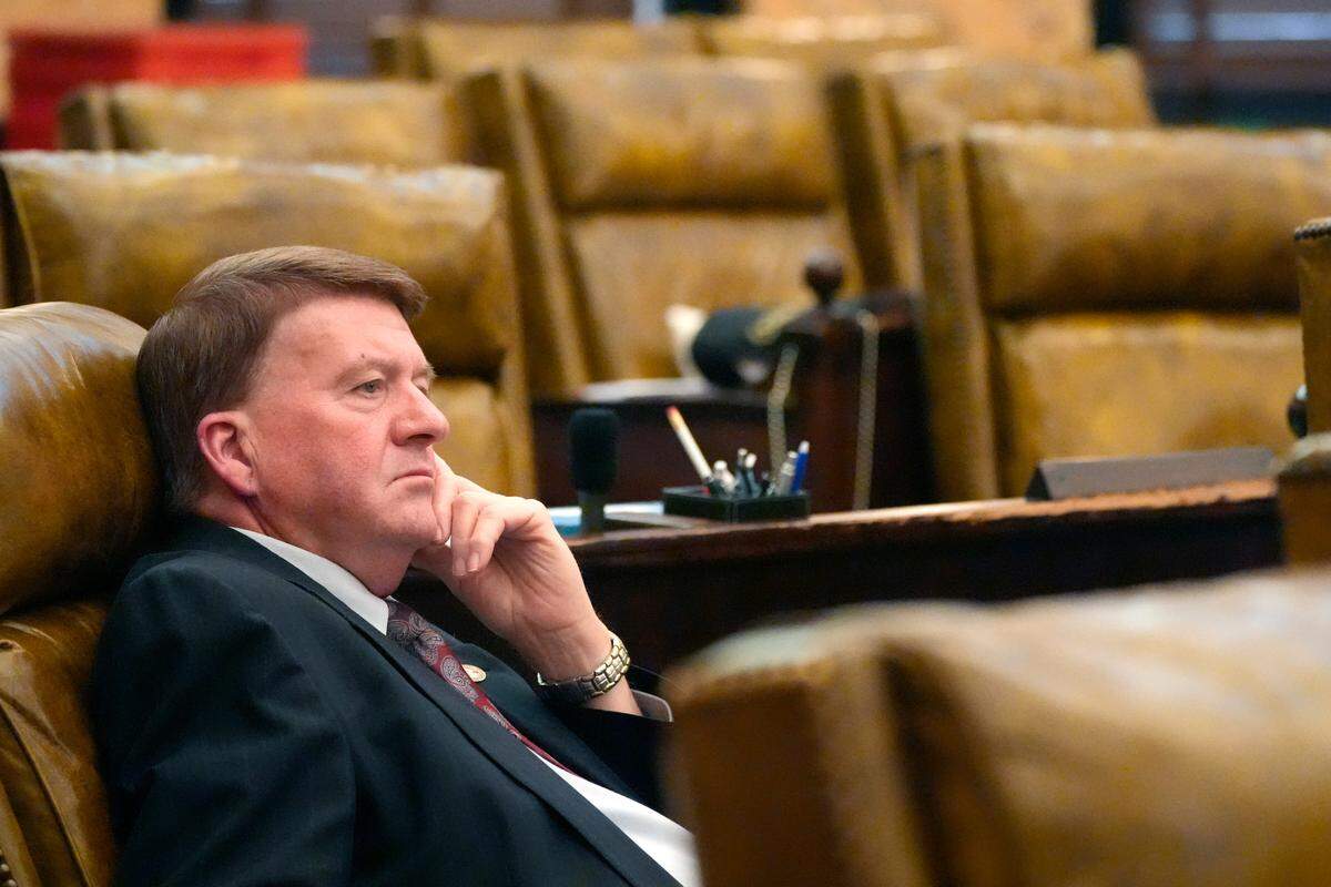 Mississippi State Rep. Greg Haney, R-Gulfport, listens as Gov. Tate Reeves delivers his address. A number of legislators missed the joint session of the state Legislature.