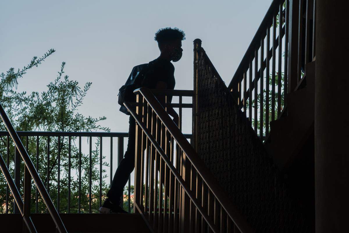 A student makes his way to his first period class on the first day at Biloxi High School amid the COVID-19 pandemic on August 5th, 2020