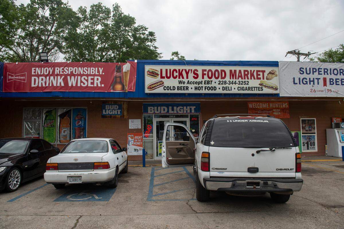 Lucky’s Food Market on the corner of Old Spanish Trail and Washington Street is the one of the only businesses in the Backatown neighborhood and serves not only as a convenience store but also as a place where community members gather in the parking lot.