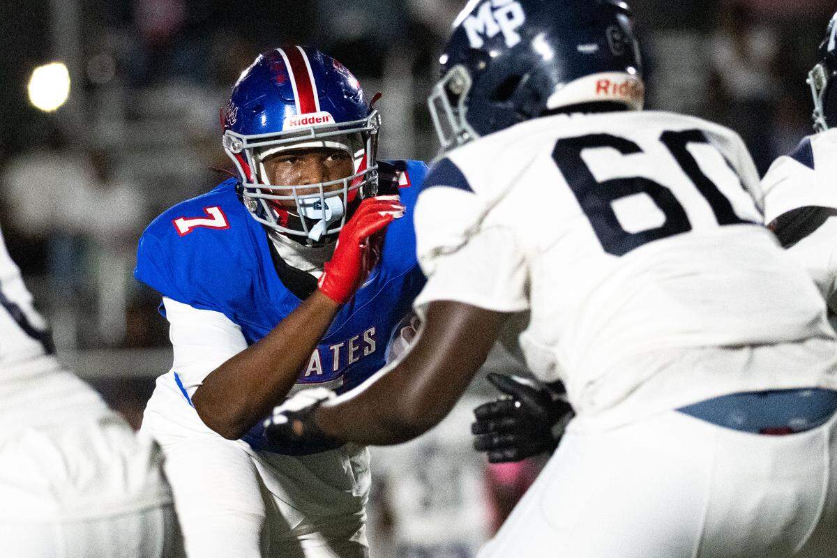 Pass Christian defensive end Mario Burks (7) rushes the passer during a football game at Francis McDonald Stadium on Friday, Oct. 17, 2025.