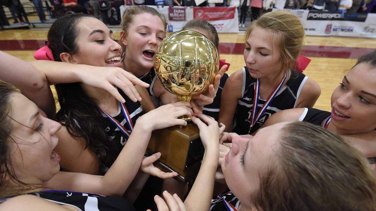 The Crescents of Our Lady Academy celebrate their Class I state title after beating St. Andrew's three games to one on Saturday, October 31, 2015, in the MHSAA State Volleyball Championships at Germantown High School in Gluckstadt, Miss.