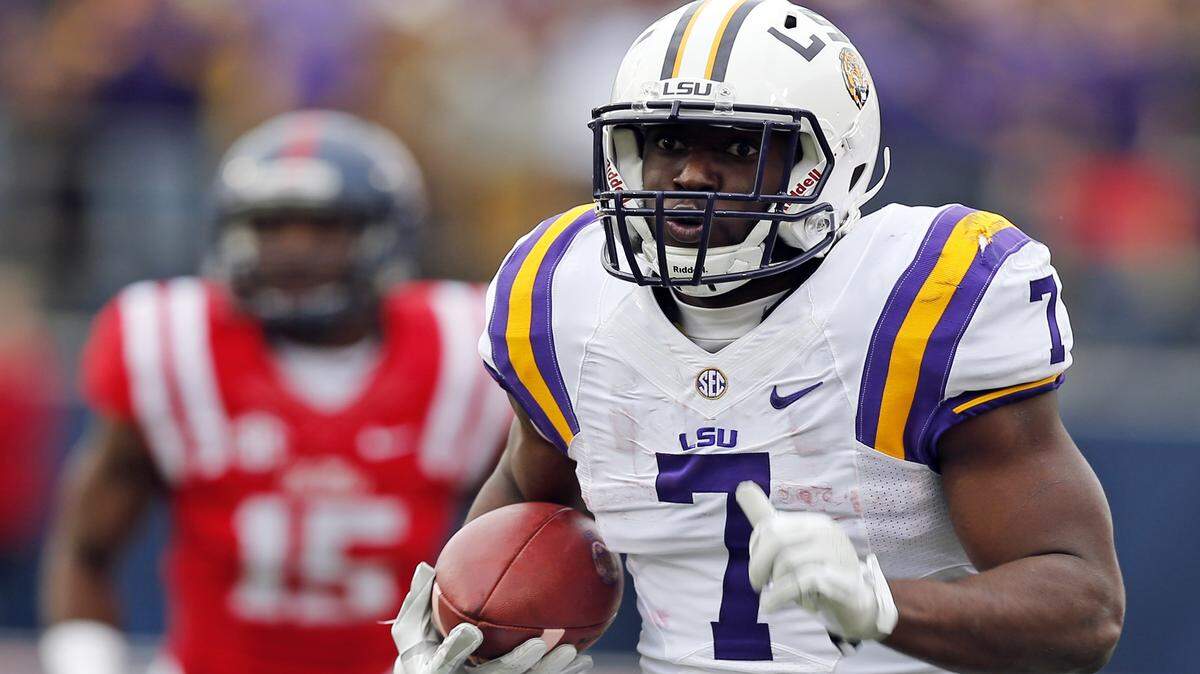 LSU running back Leonard Fournette (7) runs past Mississippi defensive back Kendarius Webster (15) for a long gain in the first half of an NCAA college football game in Oxford, Miss., Saturday, Nov. 21, 2015. (AP Photo/Rogelio V. Solis)