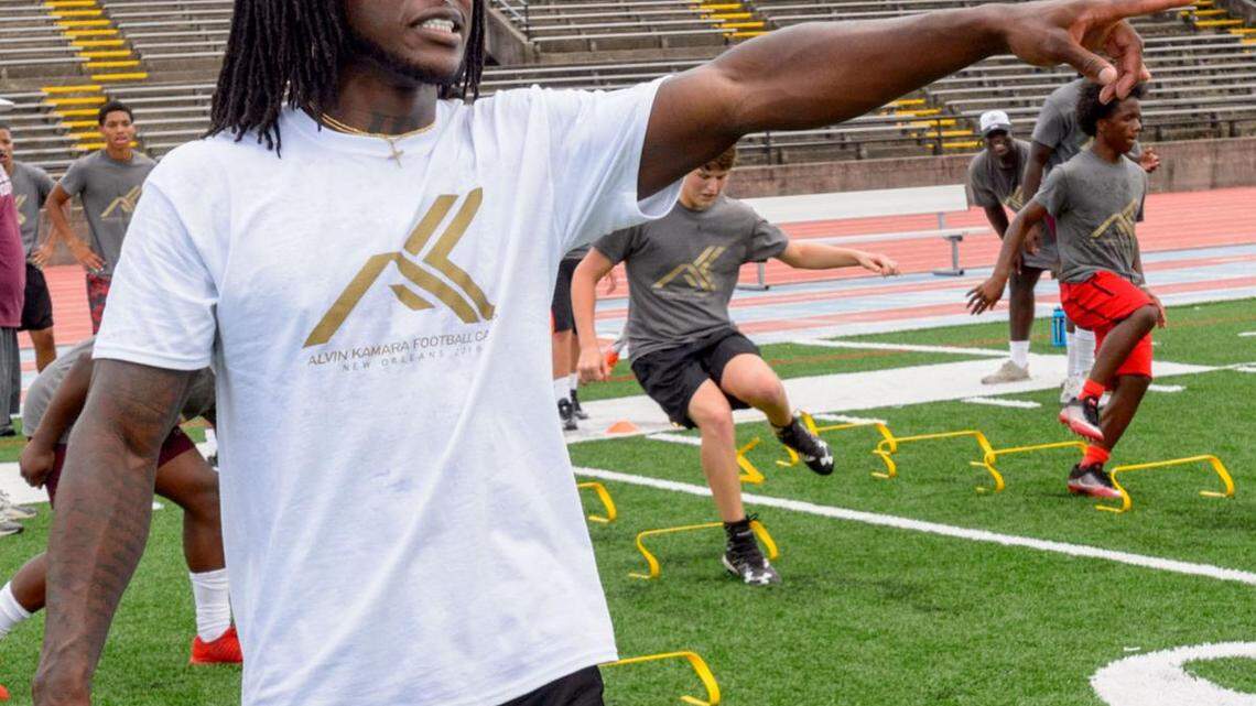 Saints running back Alvin Kamara works with football campers in New Orleans at a camp he hosted for children from 7 to 18.