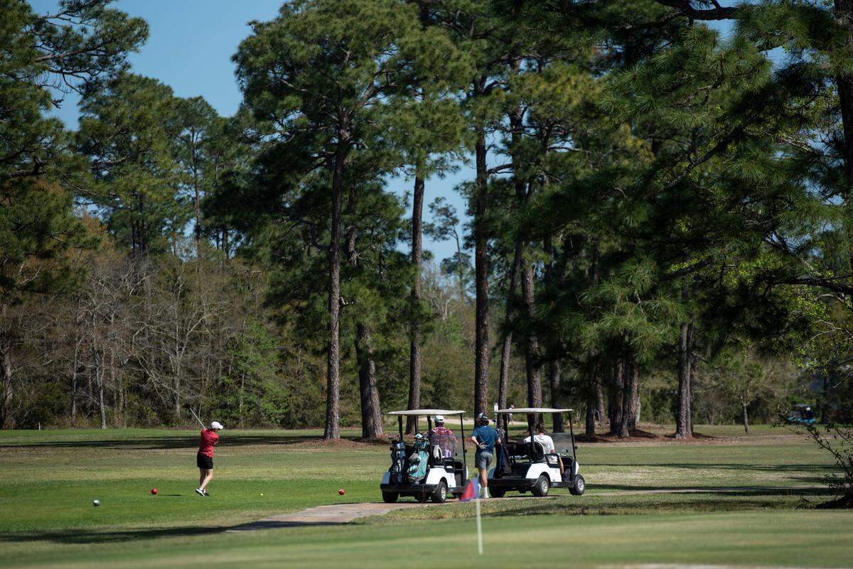 Golfers play at the Pass Christian Isles Golf Club in the Timber Ridge subdivision in Pass Christian on Tuesday, March 25, 2025.