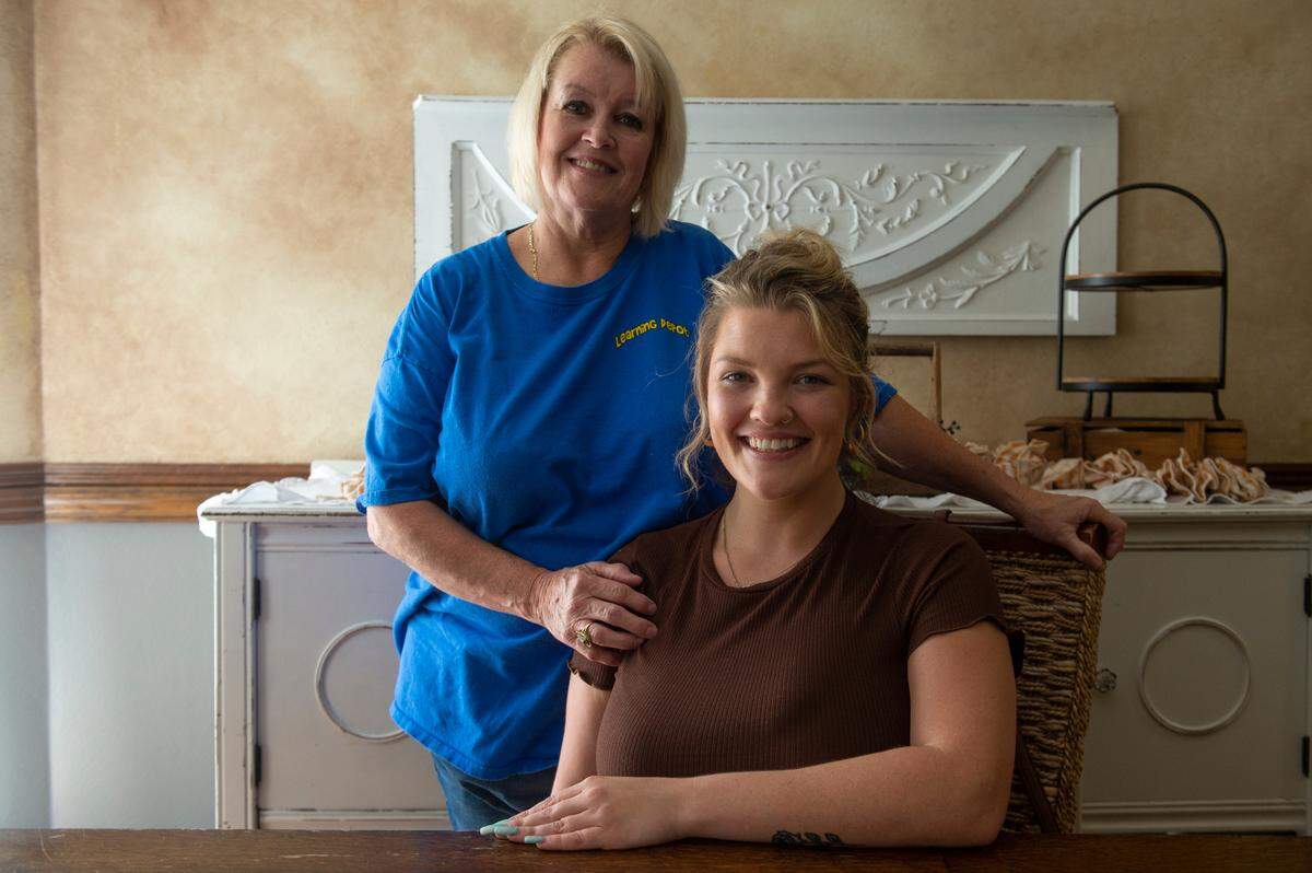 Vanessa Owens and her mother Karla Owens pose for a portrait at their Ocean Springs home on Thursday, Sept. 7, 2023.