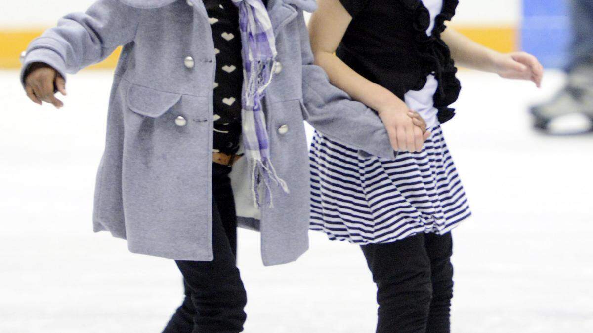 JASON VORHEES/THE TELEGRAPH/2012Reagan Jordan, left, and Abigail Henning hold hands while skating together. The Mississippi Coast Coliseum in Biloxi will open for public ice skating on Friday.