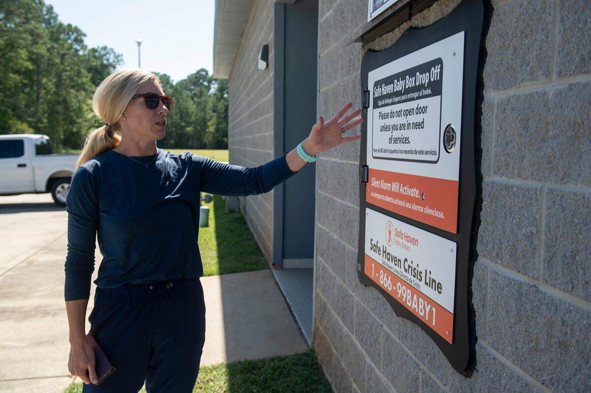 Caitlin Kelly shows off the Safe Haven Baby Box at the Long Beach Fire Department in Long Beach on Thursday, June 20, 2024. Long Beach’s baby box was the first in Mississippi.