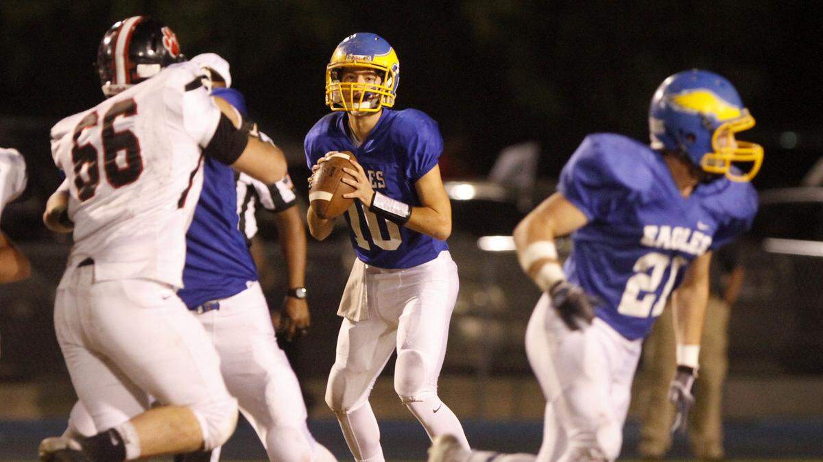 TIM ISBELL/SUN HERALD 
 Resurrection quarterback Blake Porter waits for Justice Sharp to make his cut before throwing a pass in the flat against Lumberton, Friday, Nov. 27, 2015.