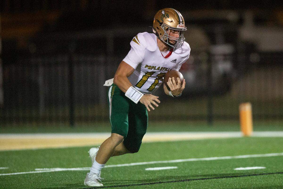 Poplarville quarterback Matt Will runs the ball down the field during a game against Lawrence County at Poplarville High School in Poplarville on Friday, Oct. 7, 2022.