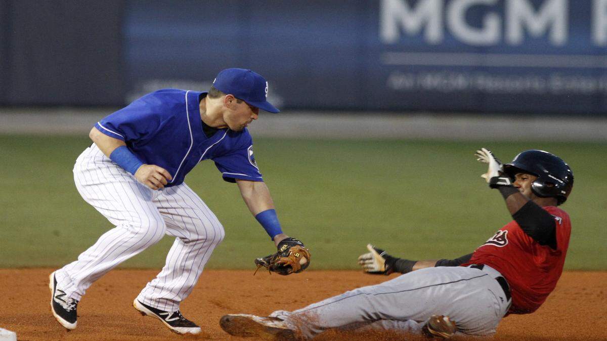 TIM ISBELL/SUN HERALD 
 Biloxi third baseman Nathan Orf tags Birmingham's Eudy Pina out, Monday, June 13, 2006.