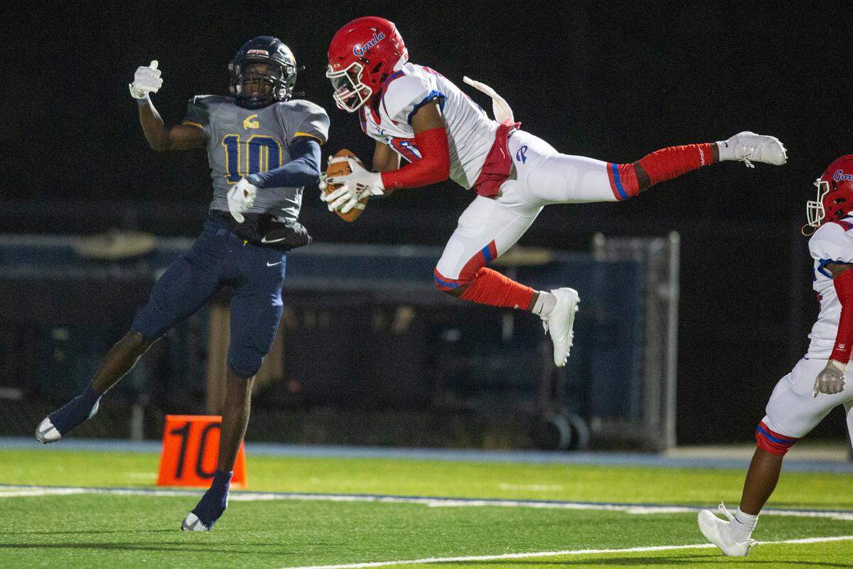 Pascagoula’s Keilon Parnell grabs the ball as he and Gautier’s AJ Philips go for the punt return during a game at Gautier High School in Gautier on Friday, Sept. 2, 2022.