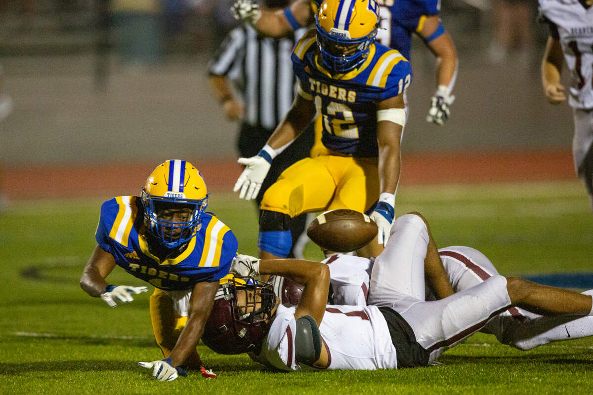 Bay High’s Jaylen Antoine fumbles the ball during a game between Bay High and Long Beach at Tiger Stadium in Bay St. Louis on Friday, Sept. 13, 2024.