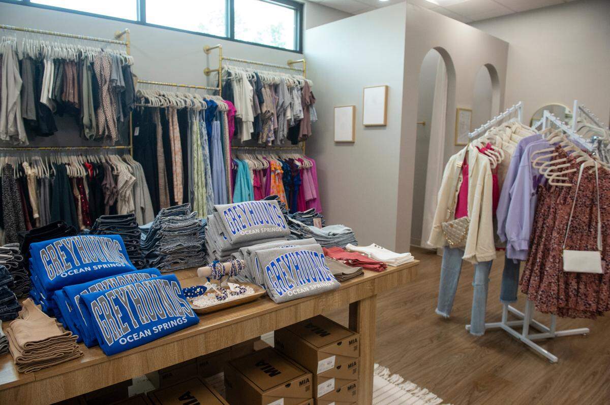 Casual and dressy clothes, along with Ocean Springs Greyhounds apparel, are for sale at the new Ivory Rose Boutique in Ocean Springs.