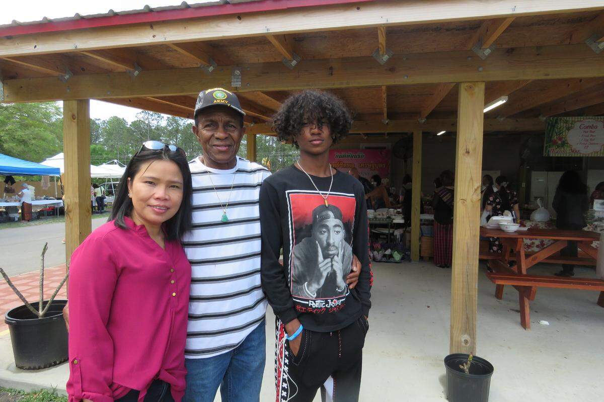 Montha Patrick, a native of Thailand, and her husband and son traveled from Brandon, Mississippi to celebrate Songkran, or Thai New Year, at Wat Buddhametta Mahabaramee in Gautier on April 11, 2021.