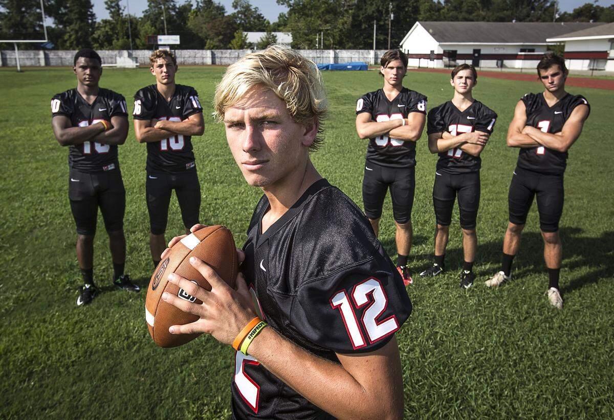 AMANDA McCOY/SUN HERALD  St. Stanislaus College quarter back Myles Brennan, 12, stands with his receivers, from left, Darius Pittman, Corbin Blanchard, Chase Rogers, Harrison Brewer and Owen Betz. Betz has already signed to play college soccer at Northern Kentucky; Brennan, Rogers and Pittman all hold multiple football offers.