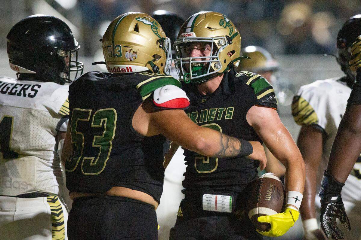 Poplarville’s Lennox Beech and Rhett McCardle celebrate after a touchdown during a playoff game between Poplarville and Mendenhall at Poplarville on Friday, Nov. 8, 2024.