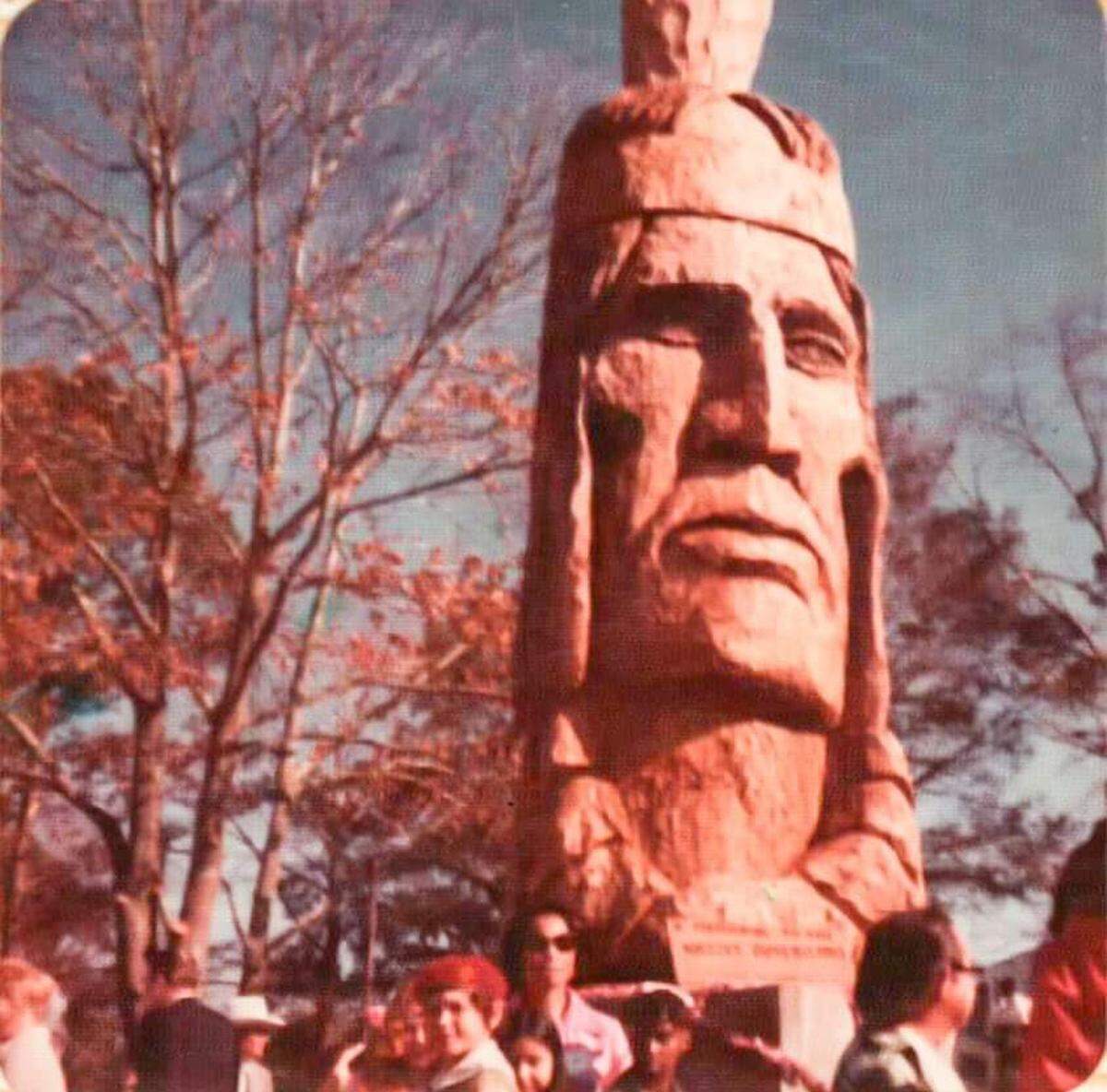 Crooked Feather was sculpted from a 2,000-year-old Cypress tree that weighed over 10 tons and was 8 feet wide at the base.