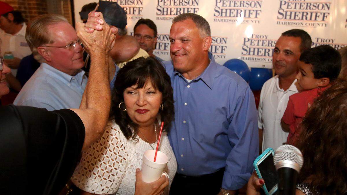 AMANDA McCOY/SUN HERALD 
 Troy Peterson is swarmed by supporters after defeating Melvin Brisolara in the primary runoff for Harrison County sheriff on August 25.