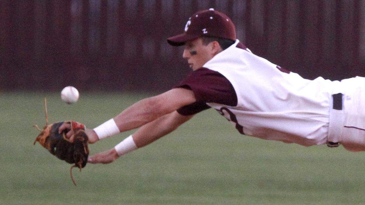 TIM ISBELL/SUN HERALD 
 East Central shortstop Reis Trager makes a diving attempt at a ground ball against Vancleave, Friday, Apr. 8, 2016.